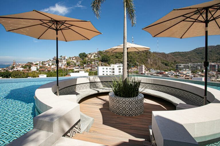 Calm bedroom with balcony at D’Vine 603 near Los Muertos Beach