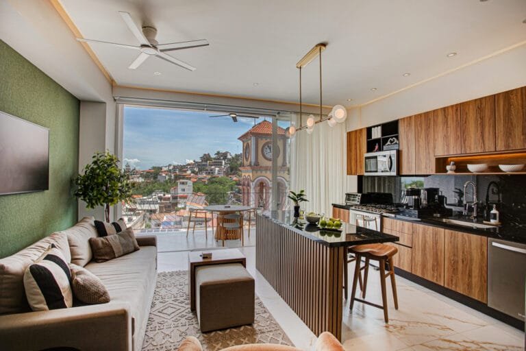 Kitchen area with island and bar stools